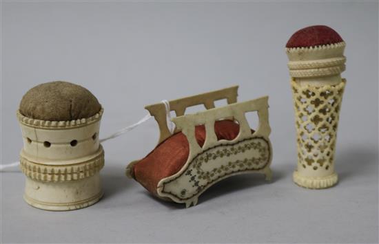 A small collection of early 19th century bone/ivory sewing accessories, including an engraved dog pin cushion, circa 1830